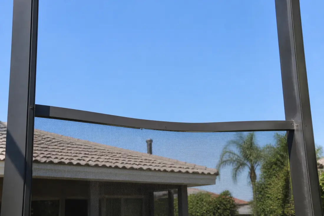A bent horizontal beam in a screen enclosure frame